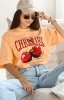 Oversizowy t-shirt cherries brzoskwiniowy